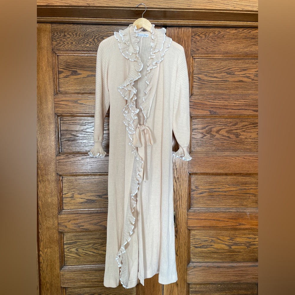 100% wool sweater dress/robe. Looks chic over tights, with knee high boots.